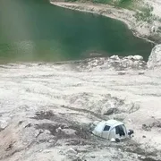 I campeggatiori sul greto del lago Fedaia in secca