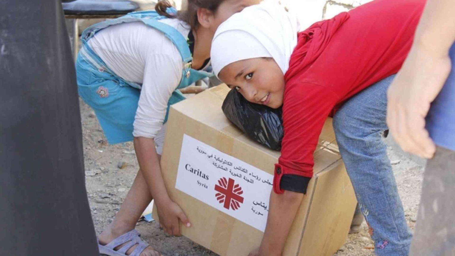 Siria, i «fiori» della Caritas tra le macerie