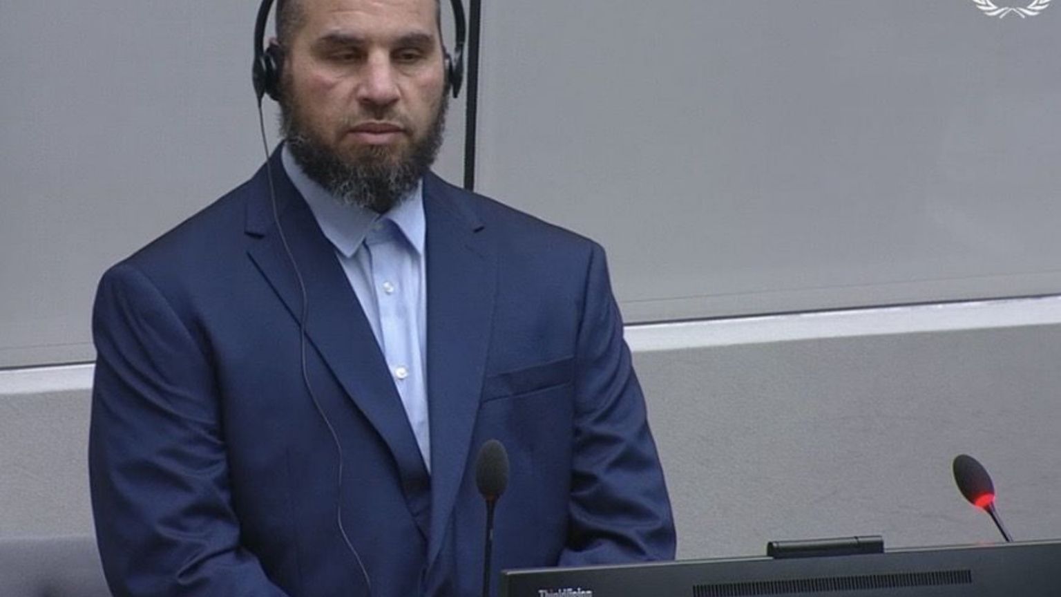 Crimini in Libia, il braccio destro di Almasri compare davanti alla Corte dell’Aja