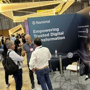 Alcune persone di fronte a uno stand di Namirial, l'ultimo dei nuovi unicorni sorti in Italia