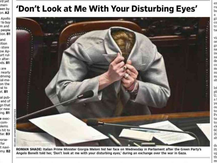 Meloni con la faccia nella giacca: la foto sul Wall Street Journal
