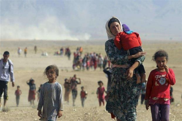 La famiglia yazida in fuga dall'Iraq settenrionale, nel 2014