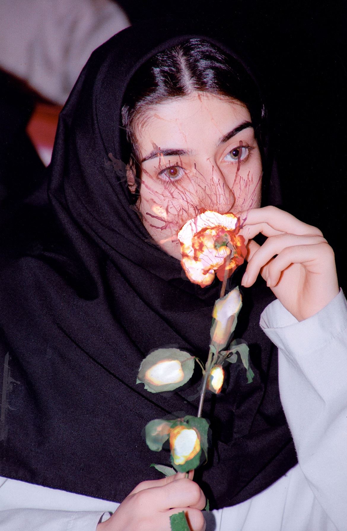 L'Iran di Newsha Tavakolian, 'And They Laughed At Me' al Mudec di Milano: la ragazza che annusa una rosa
