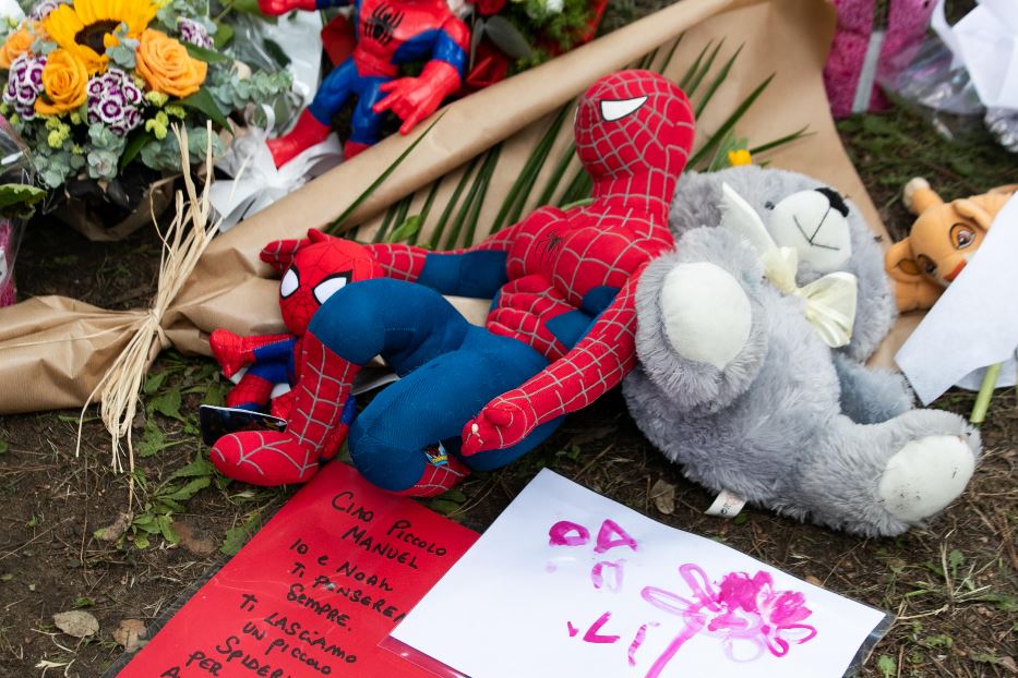 Flowers and soft toys left at the crash site