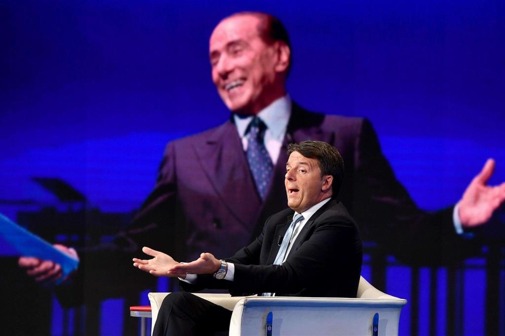 Renzi a "Porta a Porta", sullo sfondo Berlusconi (Ansa, Ettore Ferrari)