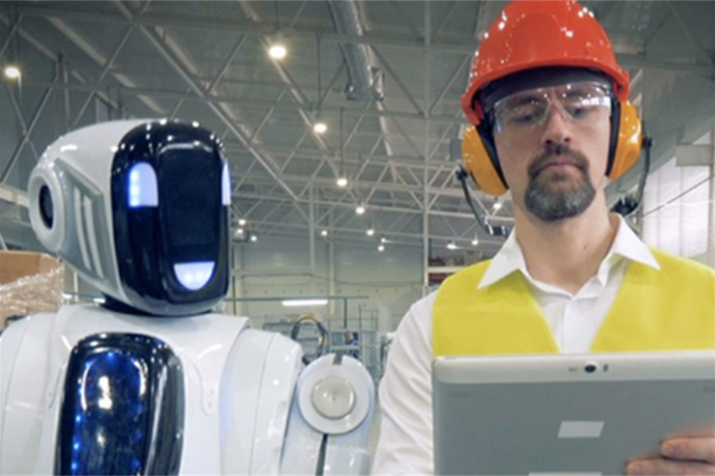 Uomo e robot al lavoro insieme