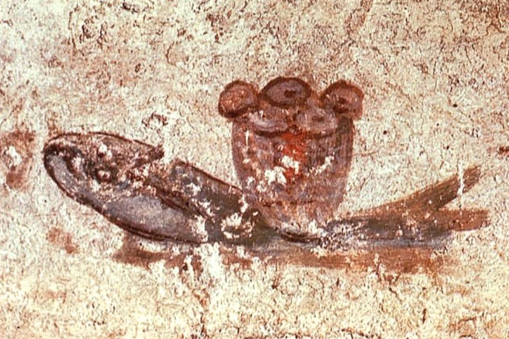 Pesce e pane eucaristico, particolare di pittura del III secolo. Catacombe di San Callisto, cripta di Lucina, Roma